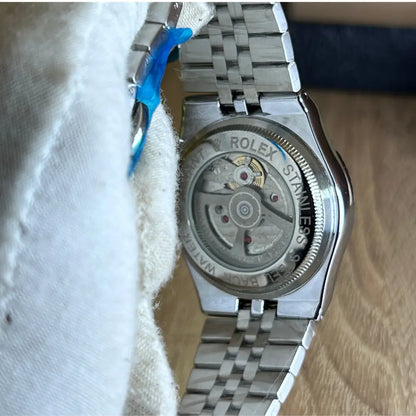 Montre Rolex Silver Motif Dial